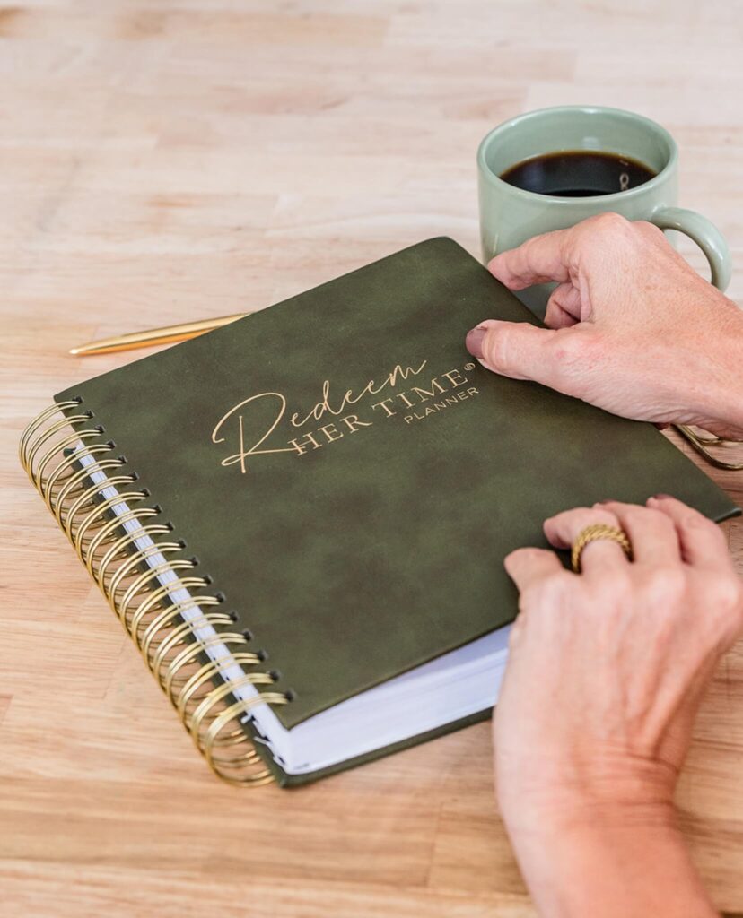 Close-up of the Redeem Her Time Planner, a faith-based productivity tool for Christian women