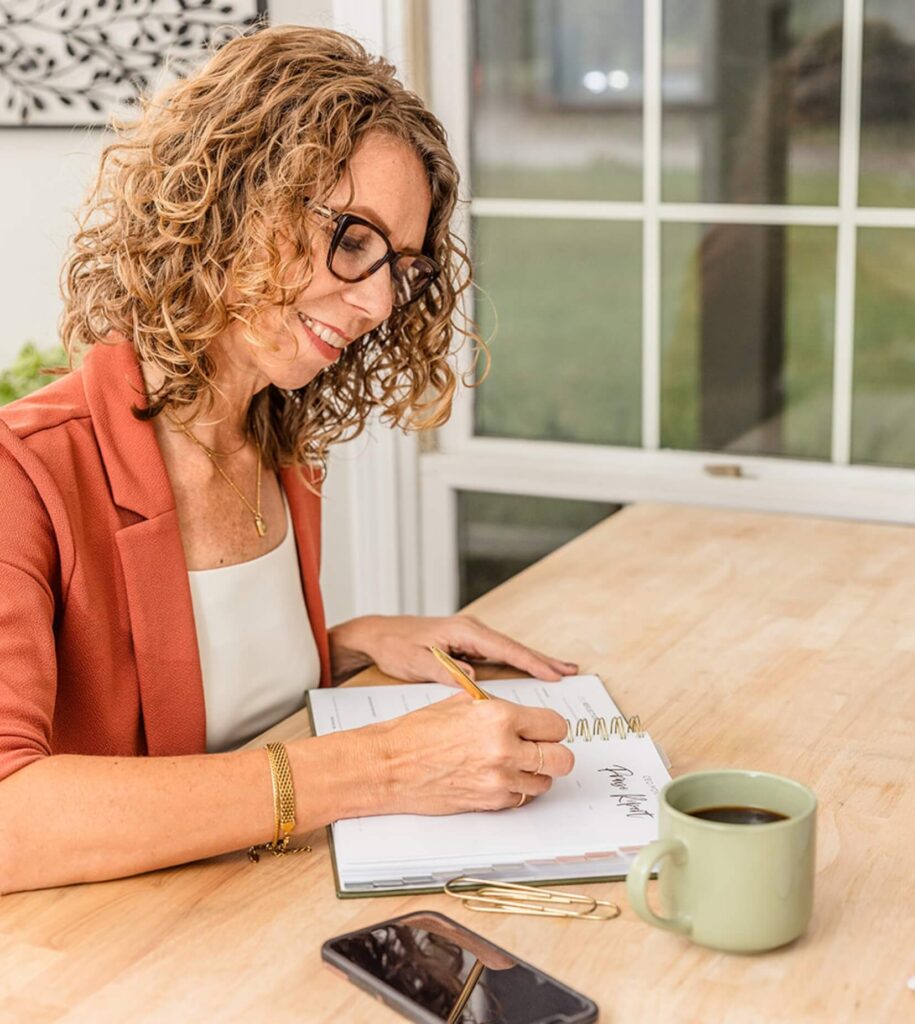 Lissa planning her year with intention using the Redeem Her Time Planner